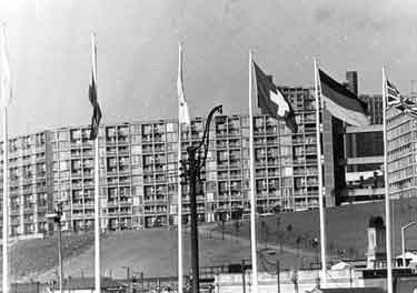 Football World Cup 1966: Flag poles outside Sheffield Midland railway station, Sheaf Street showing Park Hill flats behind
