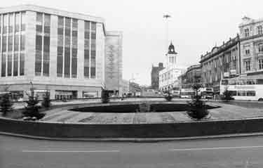 Castle Square (Hole in the Road) roundabout with Christmas trees showing Rackhams, department store (left)