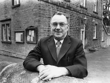 Lawrence Sykes, retiring Clerk to Bradfield Parish Council outside the Council offices, Mill Lee Road, Low Bradfield