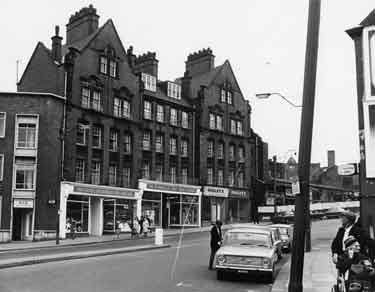 Council flats on Snig Hill showing (left to right) Sheffield and Rotherham Constabulary (Criminal Investigation Department) and W. H. Godley and Son, gents outfitters (Nos.78-80) 