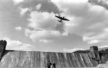 Fly past of a Lancaster bomber aircraft over Derwent Dam
