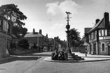 Woodhouse stocks and market cross, Market Place, Woodhouse showing (right) the Royal Hotel (No.10)