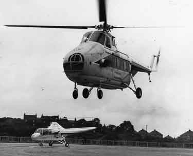 A Westland Gnome Whirlwind helicopter landing at Parkwood Springs helipad