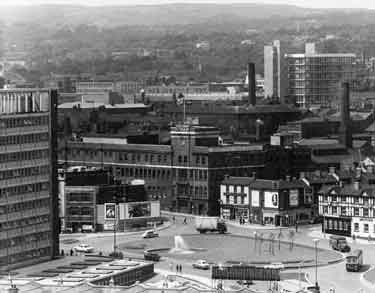 View of the Sheffield Midland railway station roundabout (latterly called Sheaf Square roundabout) showing (centre) Arthur Davy and Sons (Davy's Food Factory), Paternoster Row; (left) Sheaf House and (right) The Howard Hotel, No. 57 Howard Street