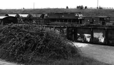 Diesel locomotive towing coal trucks at Woodhouse Junction