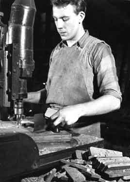 Mr Moore routing or roughly cutting to shape knife handles, Joseph Rodgers and Sons Ltd. River Lane Works at the junction of Sheaf Street and Pond Hill,
