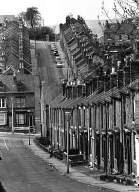 Terraced housing in Walkley, looking down Otley Street and towards Hawksworth Road going uphill opposite.