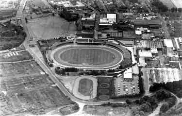 Aerial view of the Sheffield Sports Stadium (latterly Owlerton Stadium and Owlerton Greyhound Stadium), Penistone Road, Owlerton showing (left) Livesey Street and (right) George Bassett and Co. Ltd., confectionary manufacturers
