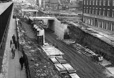 Construction of Furnival Gate roundabout and underpass showing (right) Arnold Carter and Co. Ltd, builders and plumbers merchants, Trinity Works 