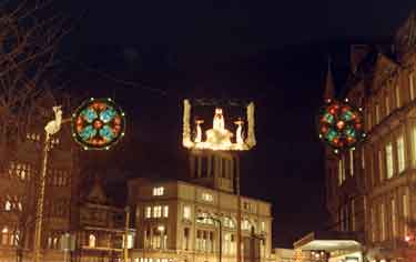 Christmas lights on bottom of Fargate and junction with High Street showing (top) Kemsley House, Telegraph and Star Offices,