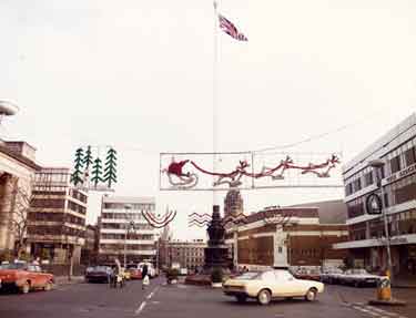 Christmas lights in Barkers Pool showing (right) Cole Brothers, department store, (centre) Barkers Pool War Memorial and Gaumont Cinema and (left) Fountain Precinct offices and New Oxford House offices