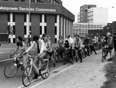 Sebastian Coe (front) leading off a bike ride at the side of the Manpower Services Commission building, South Lane