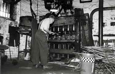 H. Ofield using the hammer machine in the first stage of the production of auger bits, J. E. Morrison and Sons Ltd., Granville Works, auger manufacturers, Tenter Street at the junction with Broad Lane 