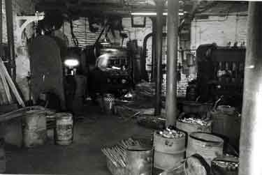 Flattening the rod using the hammer machine in the first stage of the production of auger bits, J. E. Morrison and Sons Ltd., Granville Works, auger manufacturers, Tenter Street at the junction with Broad Lane