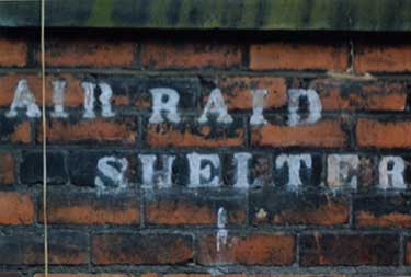 Sign for an World War 2 air raid shelter in the courtyard of Portland Works, Hill Street/Randall Street