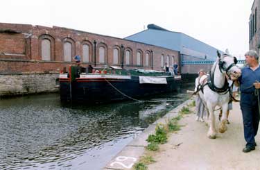 The 'Dorothy Pax' canal keel being pulled by a horse along the Sheffield and South Yorkshire Navigation towpath.