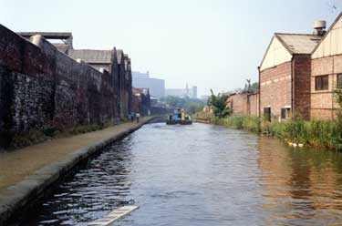 Sheffield and South Yorkshire Navigation canal, looking towards St John's Church, Park and Park Hill Flats with canal keel in the distance