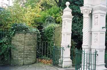Disused public lavatory (centre) at entrance to Weston Park showing Godfrey Sykes Gates (right)