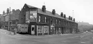Terrace housing on (right) Upwell Street at the junction with Carlisle Street East showing (centre) No.127 Tony's, barbers