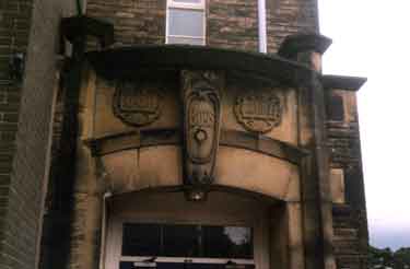 Carved stonework above the entrance to Lydgate Infant School, Lydgate Lane