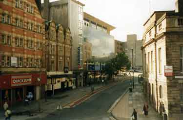 Castle Street showing (left) No.32 Quicksilver Amusements (centre) Brightside and Carbrook Co-op store, Angel Street and (right) the old Law Courts
