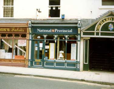 Dawsons Fabrics, National Provincial Bank and entrance to Orchard Square from Orchard Street / Leopold Street