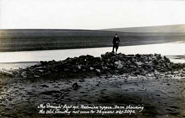Redmires Upper Dam during the 1911 drought showing the Old Smithy which hadn't been seen for 36 years