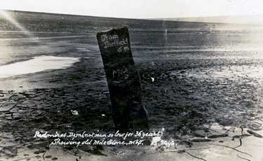 Redmires Upper Dam during the 1911 drought showing the old milestone which hadn't been seen for 36 years