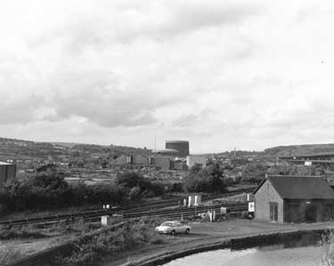 View from Sheffield Road of the former Hadfield Co. Ltd., East Hecla Steelworks being demolished, showing Tinsley Gas holders in the background and Tinsley Canal in the foreground