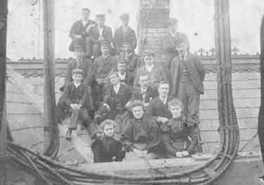 Unidentified group of employees on a roof