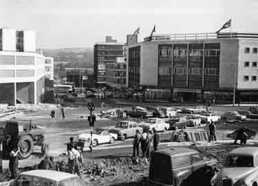 Construction of Charter Square looking towards Furnival Gate and showing (right) Pauldens Ltd., department store