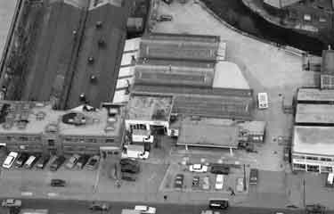 Aerial view of Penistone Road showing (left) C.I. Jenkinson and Son Ltd., tool manufacturers, Nilec Works and Smith, Widdowson and Eadem Ltd., builders merchants and ironmongers (No.296)