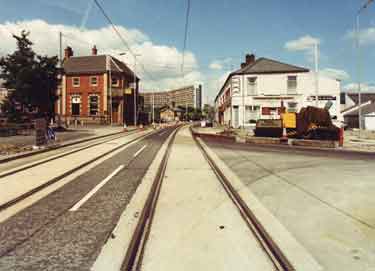 Construction of Supertram tracks on Infirmary Road showing (centre) Kelvin Flats