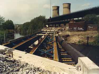 Construction of Supertram tracks alongside Tinsley Viaduct showing (back) Tinsley Cooling Towers elvin Flats and (right) Colonnade Insurance