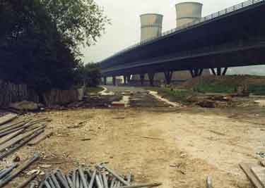 Construction of Supertram River Don bridge below Tinsley Viaduct showing (back) Tinsley Cooling Towers 