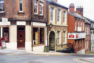 North Church Street, showing No. 7 Graysons, solicitors and Wake Smith, estate agents