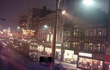 Christmas decorations on possibly Haymarket showing (right) Neville Reed Ltd.