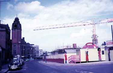 Norfolk Street showing (right) the construction of the Crucible Theatre and (left) Victoria Hall