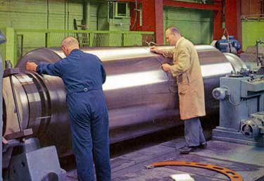 Inspecting a one-piece forged steel back up roll , 1950s