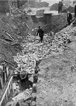 Brook Hill showing the aftermath of a high explosive bomb on a 24 inch water main on 12th December, 1940