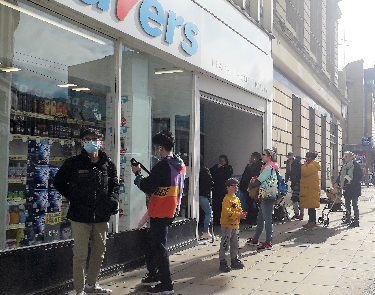 Covid-19 pandemic: queueing outside Savers on Haymarket during shortages of hand sanitizer and other products