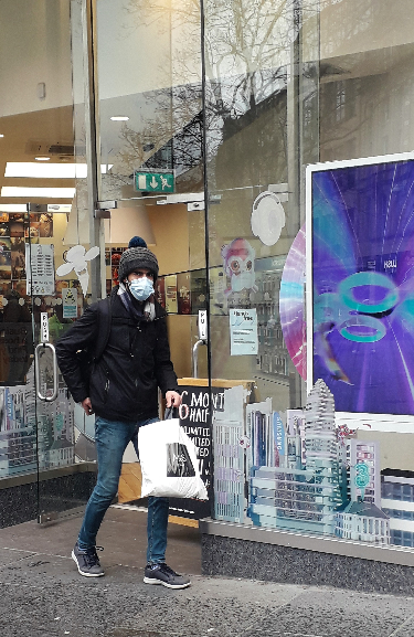 Covid-19 pandemic:  Facemasked shopper