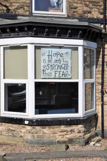 Covid-19 pandemic: sign in a house window - Hope is the only thing stronger than fear