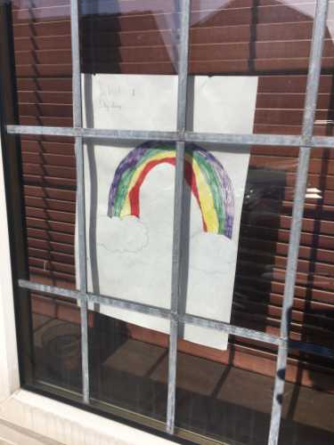 Covid-19 pandemic: rainbow window art supporting the NHS, Tadcaster Way
