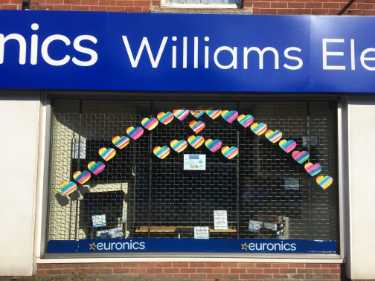 Covid-19 pandemic: rainbow window art supporting the NHS, Williams Electricals, 783 - 787 Chesterfield Road