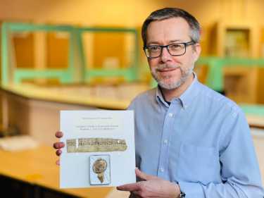 Sheffield City Council's Archives and Heritage Manager, Pete Evans, with the oldest document in the City Archives