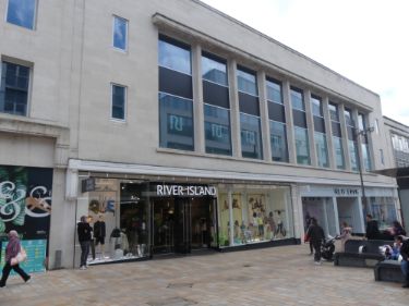 Shops on The Moor showing (l. to r.) No.15 River Island, ladies and gents fashions and Nos. 17 - 19 New Look, womens clothing