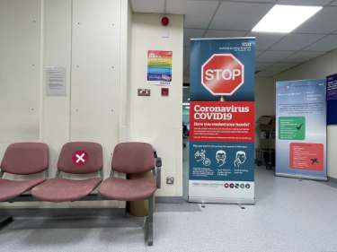 Covid-19 pandemic: Signage and seating, Minor Injuries Unit, Royal Hallamshire Hospital