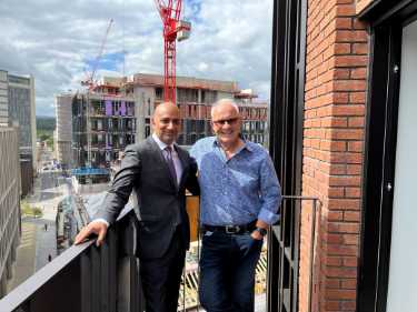 Councillor Mazher Iqbal (Co Chair of Transport, Regeneration and Climate Committee) meets a new resident at Burgess House, Cross Burgess Street