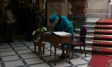 Queen Elizabeth II signing the visitors' book at Sheffield Town Hall